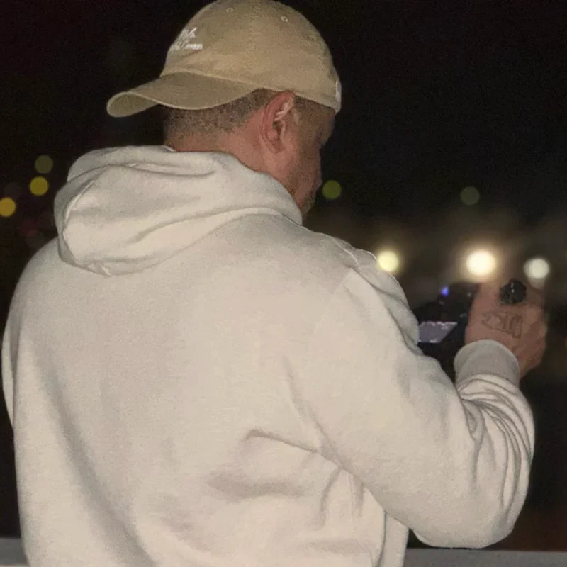 J.O. King shooting a night scene, camera raised — the man behind Pixel Perfect Visuals
