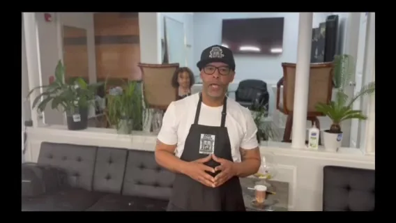 Owner of El Don Salon on the shop floor between the styling chairs, brand film by Pixel Perfect Visuals