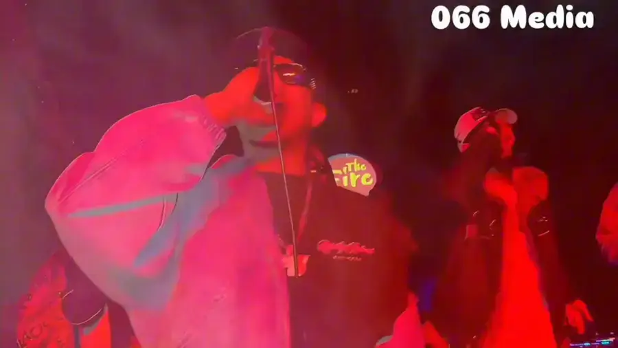 Live concert coverage under red stage light at The Fire, filmed by 066 Media