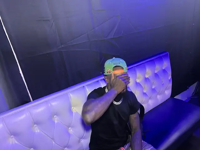 BSF Tone 066 seated in a lit booth at the venue, artist portrait by Pixel Perfect Visuals