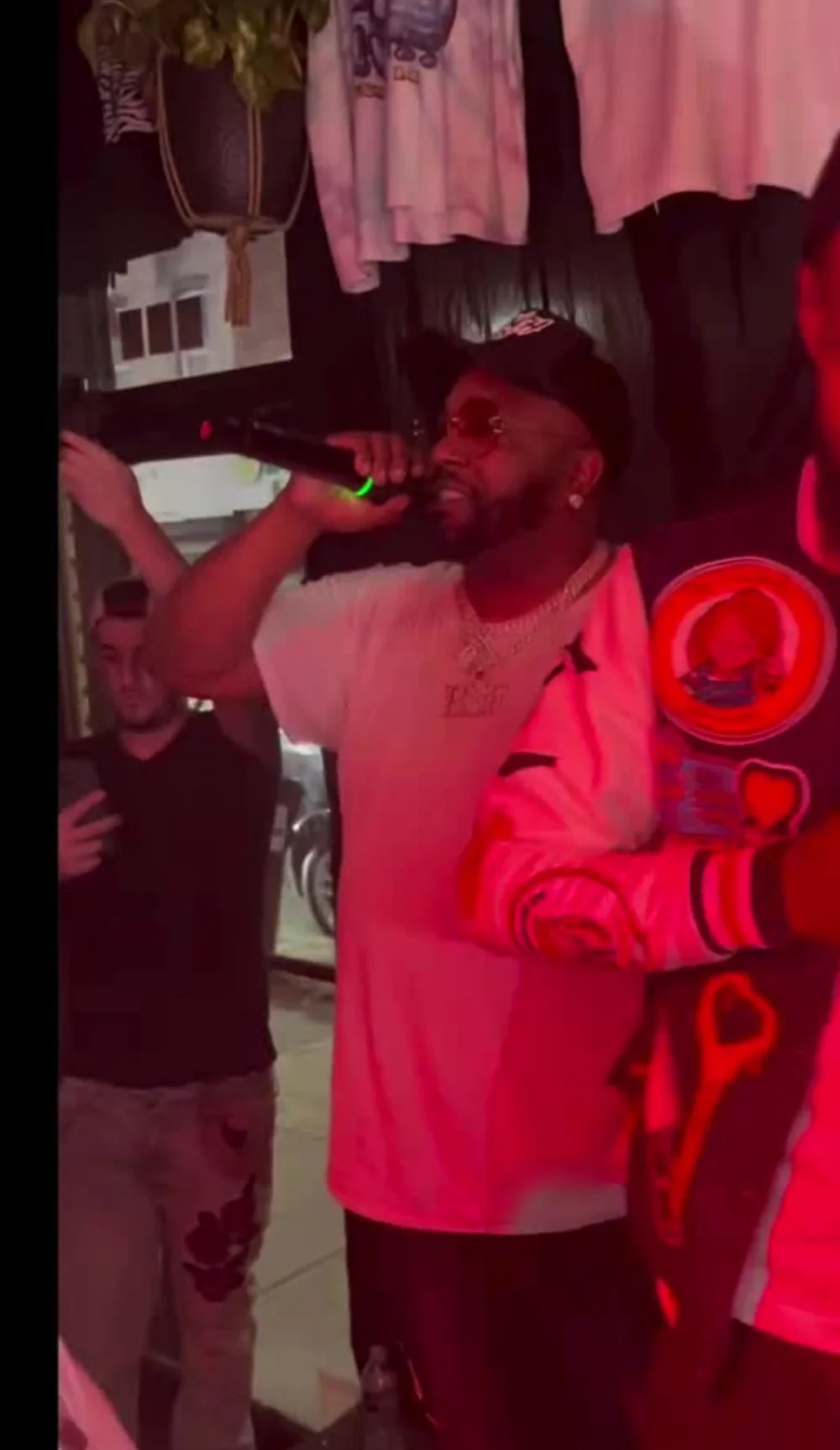 Intimate performance in deep red light at Cratediggaz Records, South Street — 066 Media