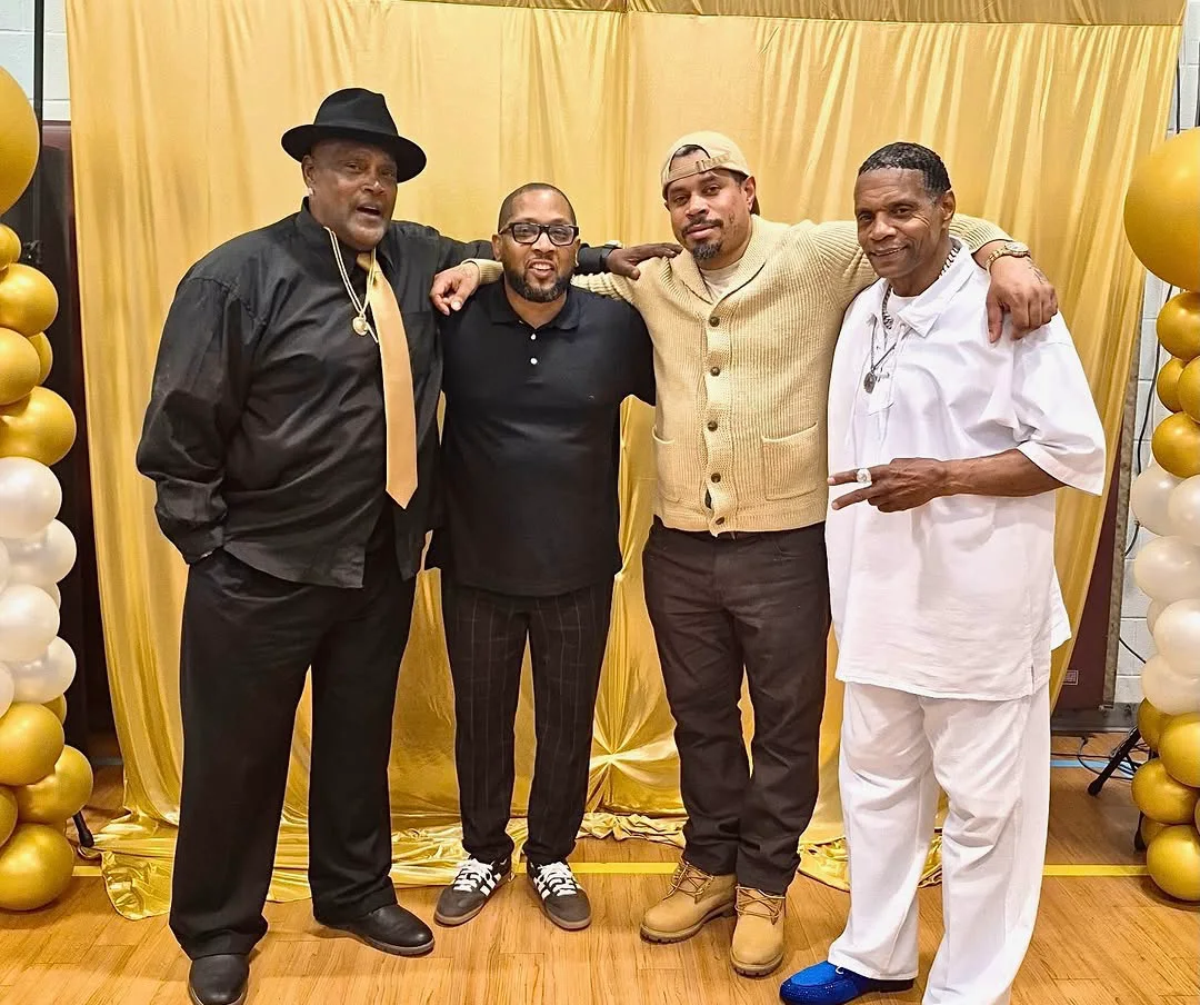 Group portrait at a gold themed family celebration — event coverage by Pixel Perfect Visuals