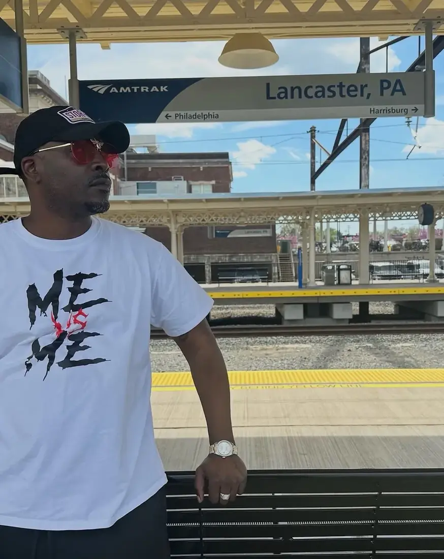 Portrait leaning on a bench at the Lancaster, PA Amtrak platform, shot by Pixel Perfect Visuals