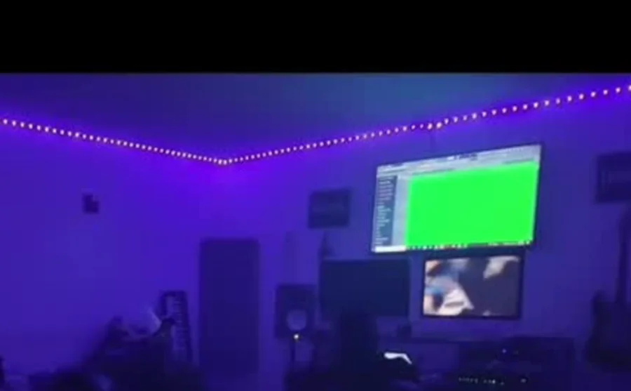 Recording studio session bathed in purple light — media production by 066 Media